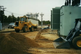 Utility Site early phase, moving material to prepare for underlayment of environmental barrier material